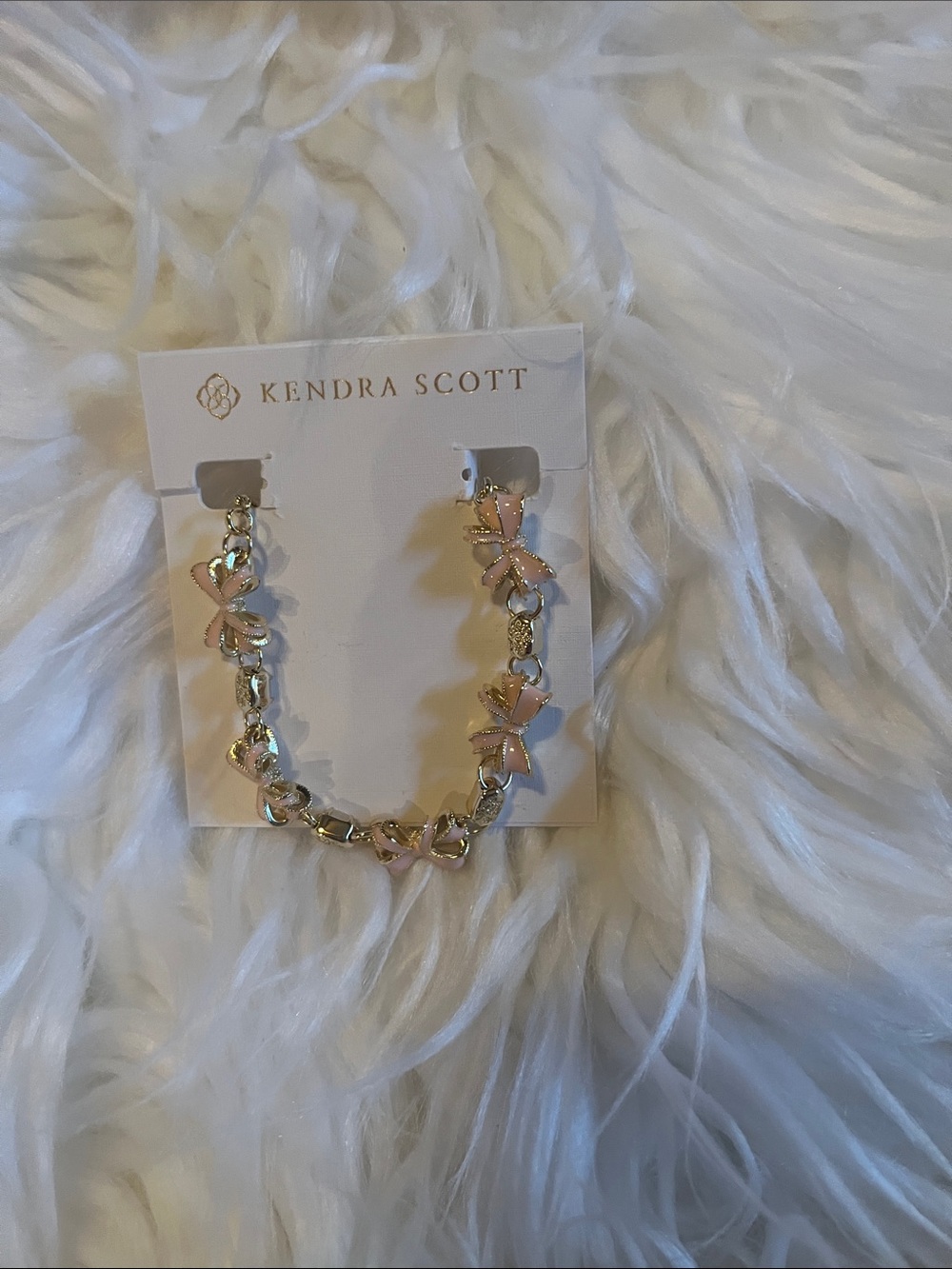 Kendra Scott Gold Chain Bracelet with Pink. Bow charms